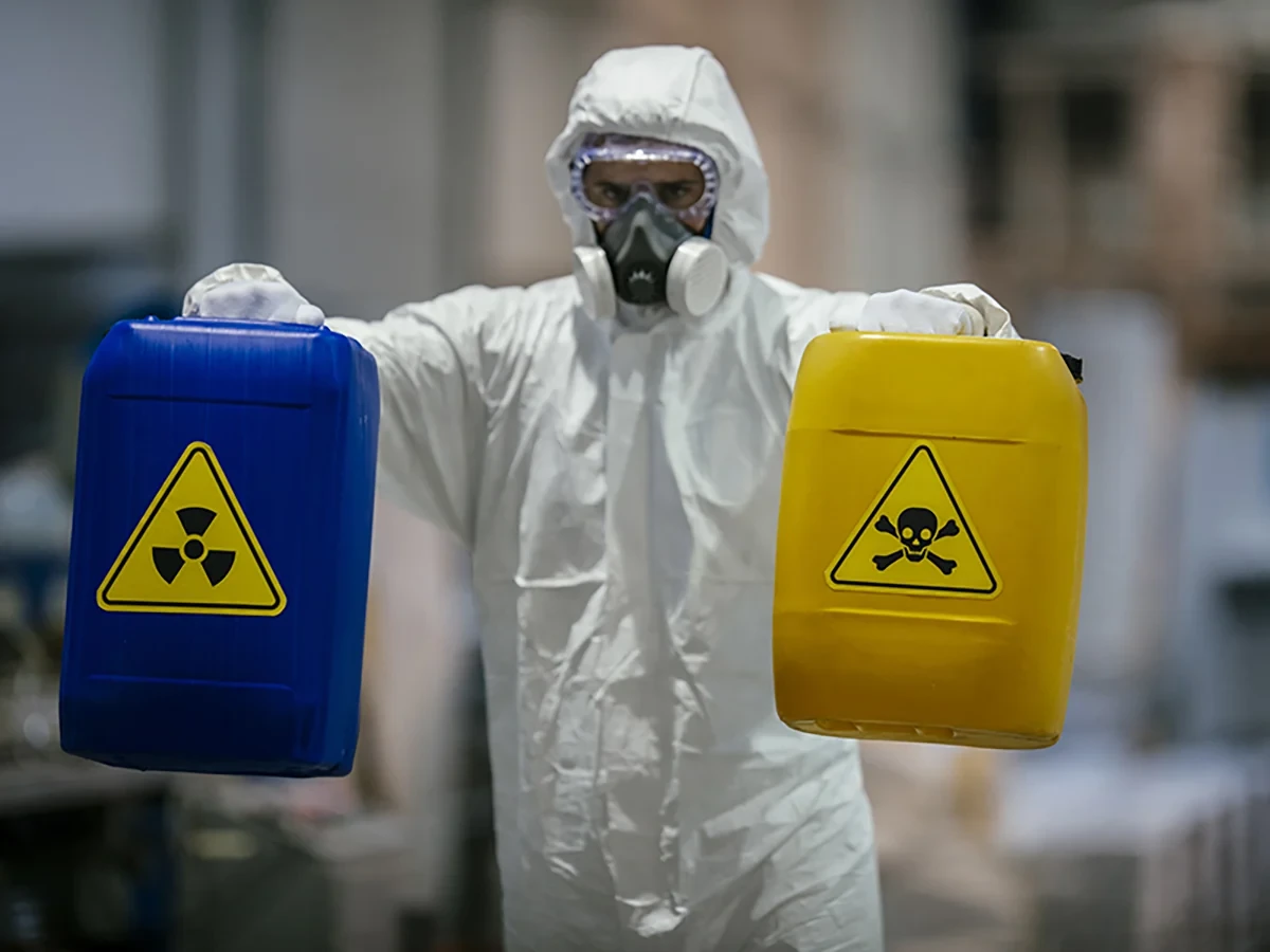 Biohazard cleanup technicians in protective equipment at a remediation scene in Neenah, WI